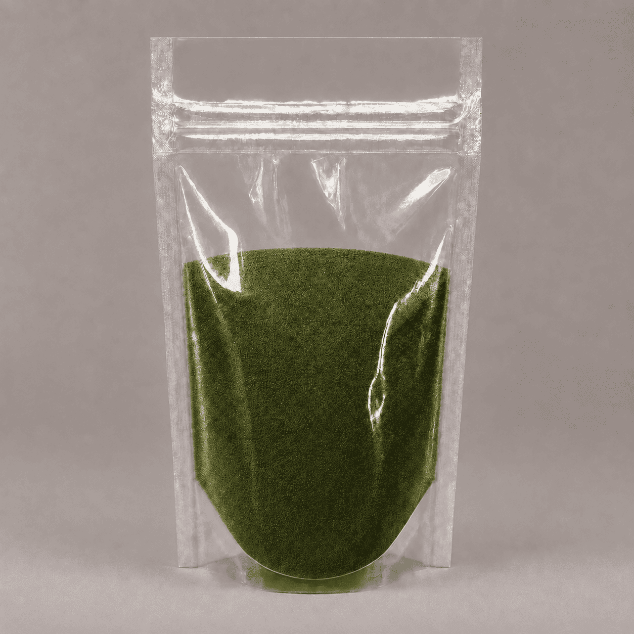 Transparent verpacktes smaragdgrünes Metallic-Pigment als feines Pulver im wiederverschließbaren Standbeutel.